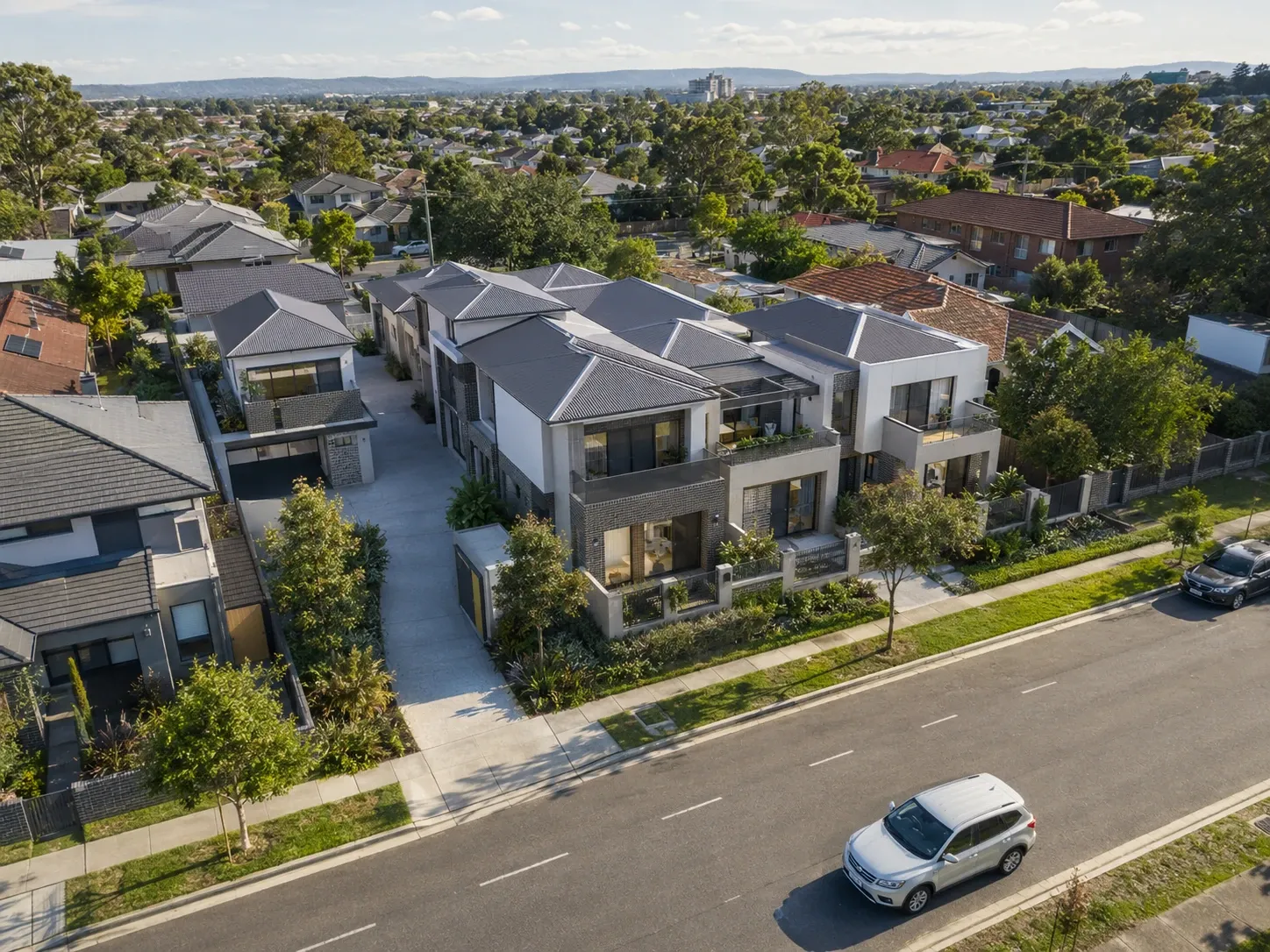 Aerial render of a townhouse development showing the scheme in its surrounding streetscape